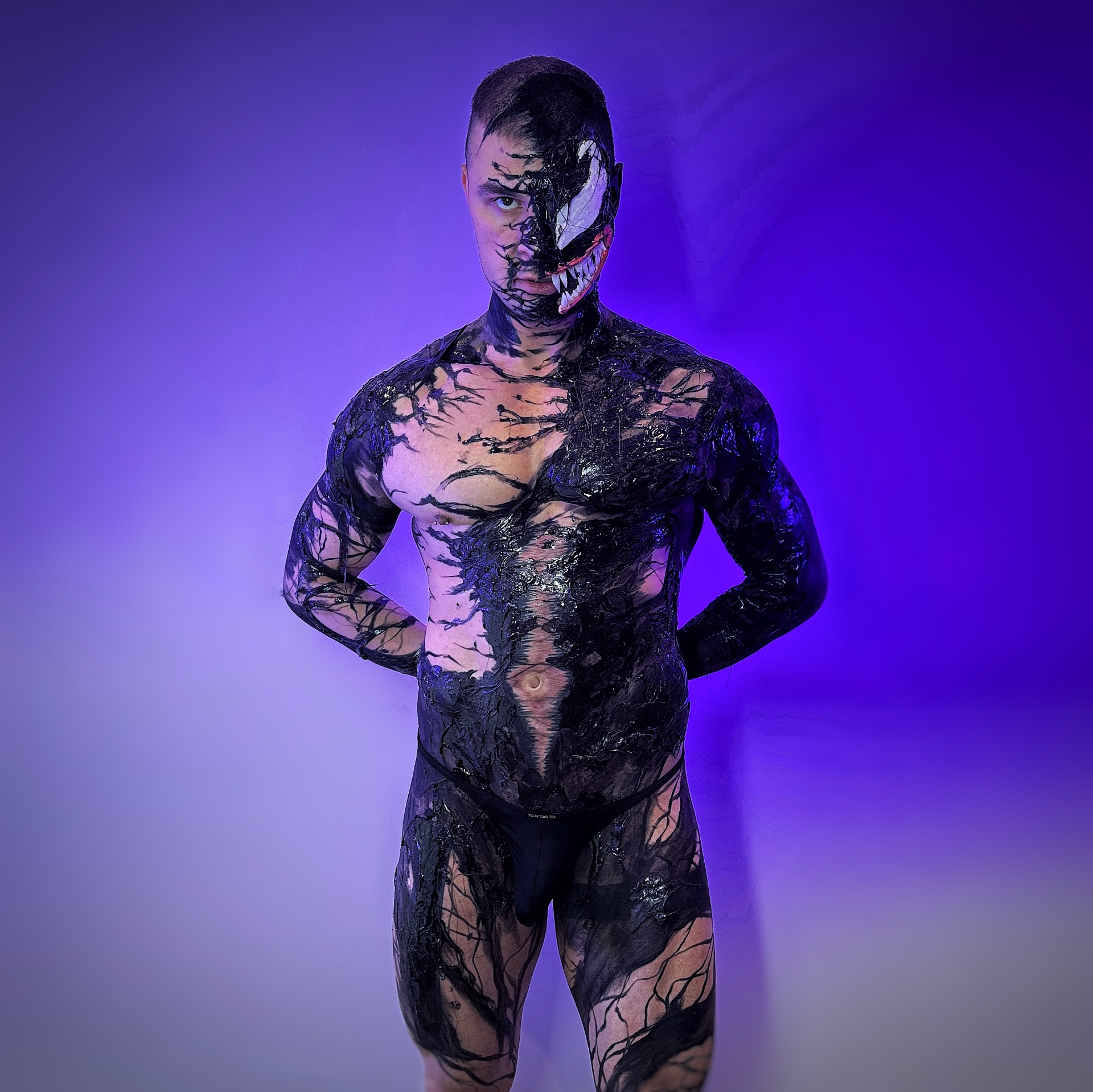 Full body paint of VENOM — Symbiote tendrils crawling across the skin.